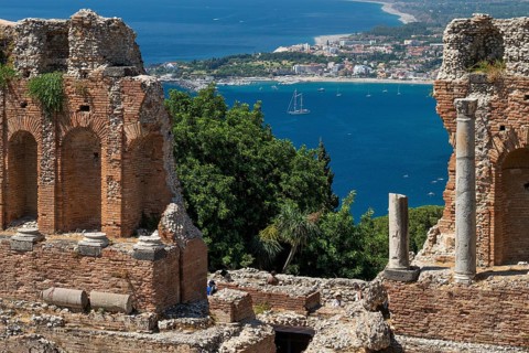 View of ancient theatre, the coast near Naxos and the Mediterranean Sea, Taormina, Sicily, Italy