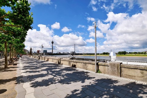 Düsseldorf, Germany - June 9th 2026: Riverside promenade 'Rheinuferpromenade' with Rhine River,