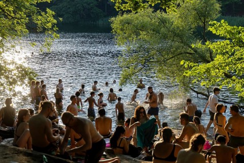 Berlin, Germany -28.6.2026: People cool off in the evening in the Krummen Lanke, a lake in Berlin,