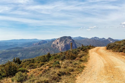 Dirt road, hiking trail to Mirador de los Buitres, mountain landscape near Huesca, Aragon,