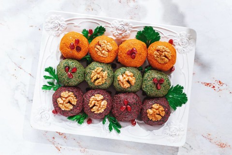 Assortment of Pkhali, pumpkin, spinach and beetroot, Georgian dish, on a white plate, appetizer