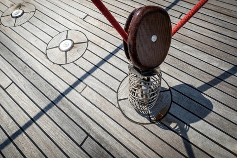 Wooden deck of a boat with rope or line and pulley or block, Aeolian or Lipari Islands, Sicily,
