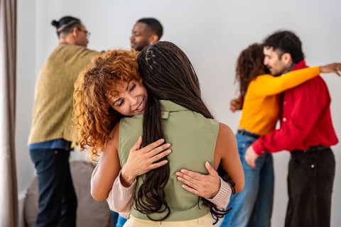 Diverse young people participating in a group therapy session, finding comfort and support while