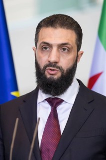 Ahmed al-Sharaa (President of the Syrian Arab Republic) at a joint press conference with Friedrich