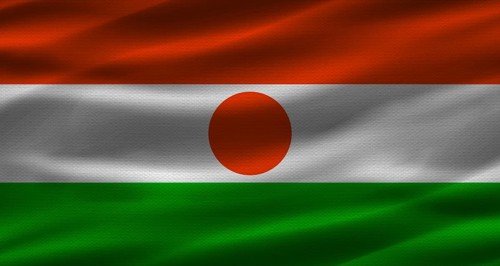 Nigerien flag with fabric texture. Realistic flag of Niger waving