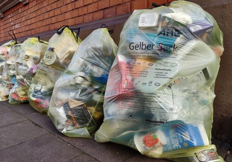 Several yellow bags leaning against a wall, Witten, Ruhr region, North Rhine-Westphalia, Germany