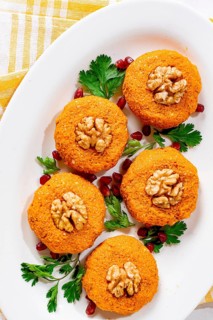 Pumpkin phali, Georgian dish, on a white plate, pumpkin appetizer with nuts and spices, no people,