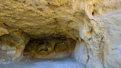 Neolithic caves, former hippie paradise, sandstone cave with dry, calm atmosphere in natural light,