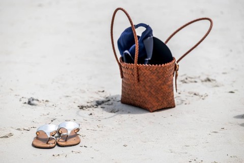 Sandals and handbag in the sand, Koh Larn, Thailand