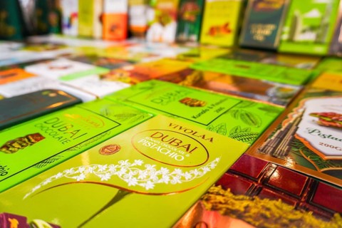 Dubai, UAE - 16th january, 2026: Selective focus colorful Dubai chocolate bars shelf. Pistachio,
