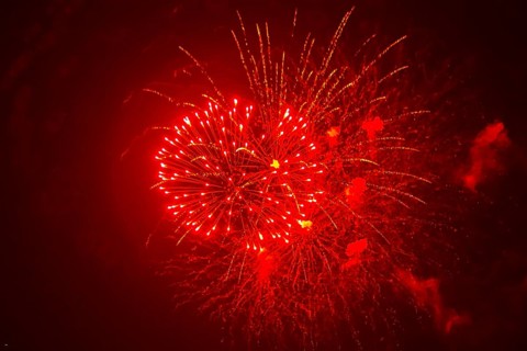 Red fireworks illuminate the night sky, Ternitz, Lower Austria, Austria
