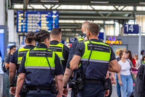 Security personnel at Stuttgart Central Station. DB Security Mobile Support Group. Travelers in the
