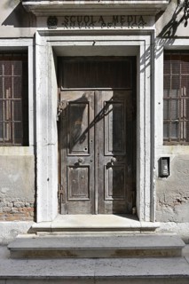 Nostalgic entrance to a school in an Italian village
