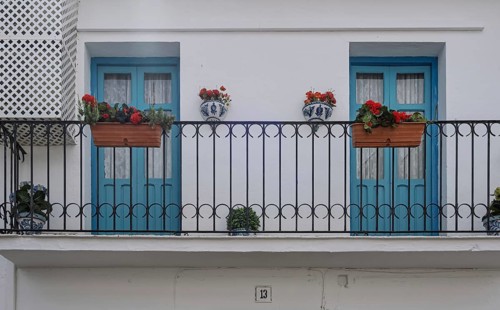 Balcony with two blue doors, Vinuela, Malaga Province, Andalucia, Spain