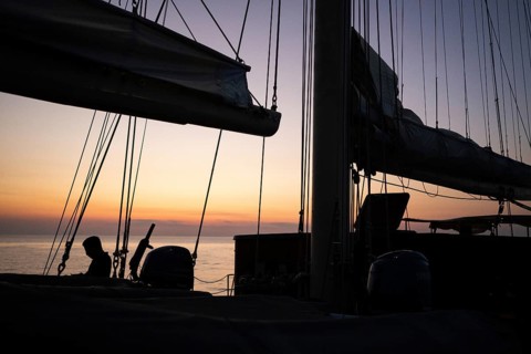 Daytime of a sailing ship, ropes, lines, sails, mast, sunset, Strait of Messina, Calabria, Aeolian