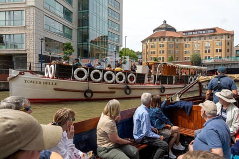 Passengers onboard boat trip on the Floating Harbour, River Avon, Bristol, England, UK
