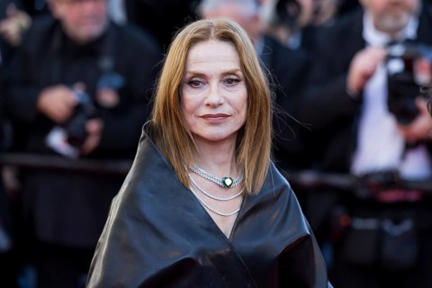 Isabelle Huppert with Karma on the Red Carpet at the Palais des Festivals et des Congrès during the