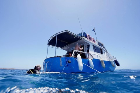 Divers aboard a dive boat are preparing for their trip, meteor wreck dive site, Russian hydrofoil