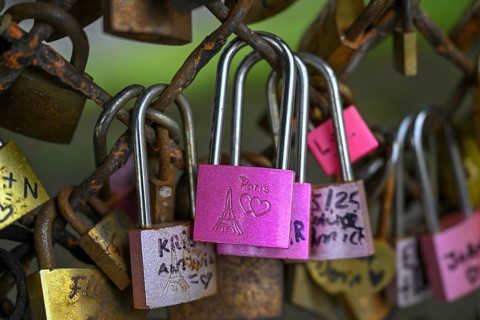 Love locks on a fence in the Montmartre district, 18th arrondissement, Paris, Île-de-France region,