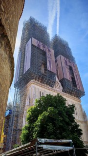 Zagreb Cathedral church tower under renovation with extensive scaffolding under blue sky, Zagreb,
