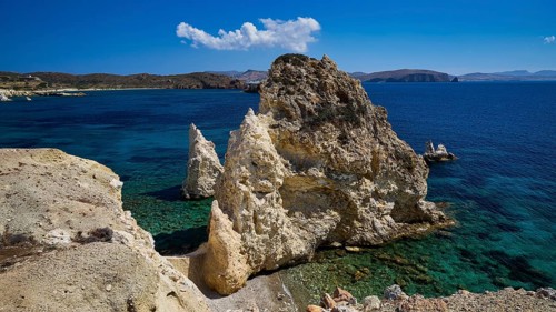 Cliffs and rocks on a sunny coast with deep blue sea and clear sky, Aspragremna, White Cliffs,
