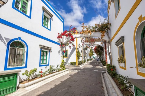 Puerto de Mogan typical colorful houses with flowers on Gran Canaria island vacation trip in Puerto