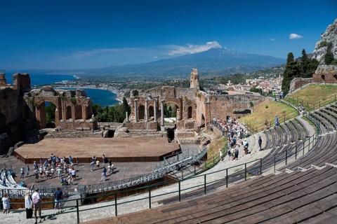 View of ancient theatre, the Mediterranean and Mount Etna, Taormina, Sicily, Italy