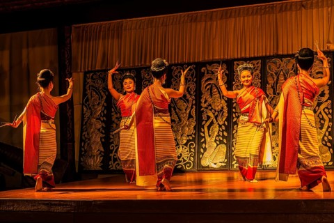 Young Thai women in traditional dress showing a traditional dance, Old Chiang Mai Cultural Cent,