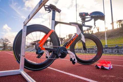 Professional racing bike on a track with matching running shoe and helmet, triathlon bike, Calw,