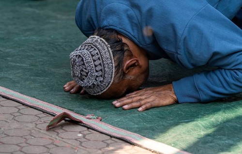 A Muslim devotee offer prayers on the first Friday of the holy month of Ramadan at a mosque, in