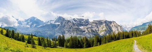 Hiking trail on Mettlenalp, mountain panorama with peaks Eiger, Mönch and Jungfrau, Bernese Alps,