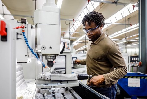 Remscheid, North Rhine-Westphalia, Germany - Trainees in metal professions, here at a machine tool,