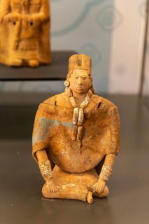 Figurine model of sitting man, from Jaina, Late Classical period, Mayan archaeological museum, Fort