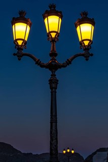 Three-flame, illuminated candelabra lamp, at the Sultan's Palace, Muscat, Arabian Peninsula,