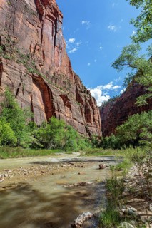 Virgin River runs between sandstone rock formations along the Riverside Walk in the Temple of