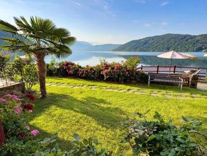 View from the Hotel See-Villa Villa Tacoli over Lake Millstatt, on the left of the picture is a