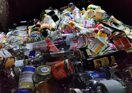 View of a full old glass container with clear glass, recycling, regenerative waste recovery,