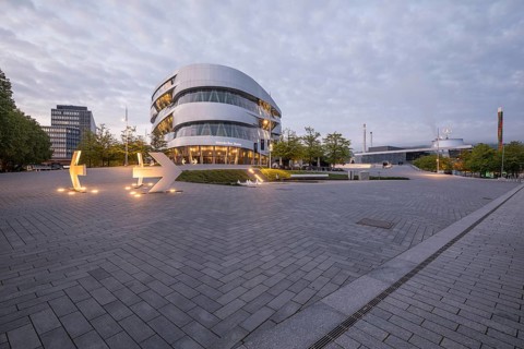 08.05.2026 Mercedes Benz Museum with illuminated modern architecture and empty plaza at dusk in