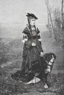 An elegantly dressed young woman in historicizing costume walking in an autumn or rural landscape