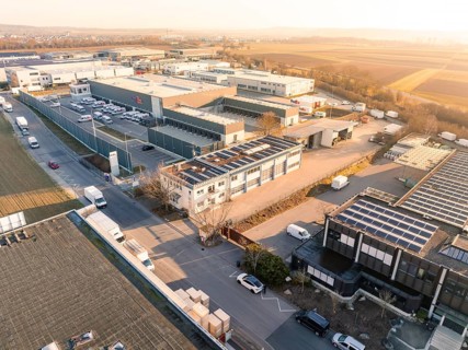 A building in an industrial environment with solar panels on the roof, Bauhof, Nufringen, Germany