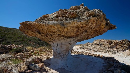 Impressive natural rock formation with rocky texture under blue sky, mushroom rocks, mushroom rock,