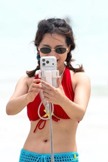 Woman selfie on beach, Koh Larn, Thailand