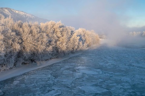 Fog over the freezing river Glomma (Glåma), Alvdal, Hedmark, Innlandet, Norway, February 2026