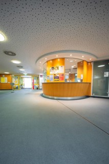 Bright reception area with wooden and glass elements, Nagold Hospital des Klinikverbund Südwest,