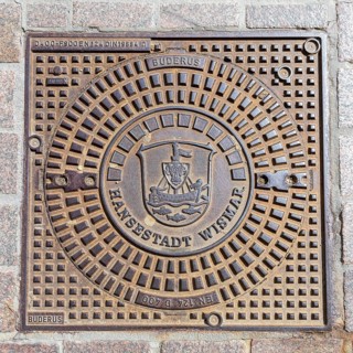 Manhole cover with coat of arms of the Hanseatic City of Wismar, Mecklenburg-Western Pomerania,
