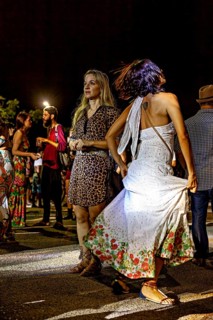 Women dance and move elegantly at a nighttime concert, joy and dance at a festival in Petrolina in