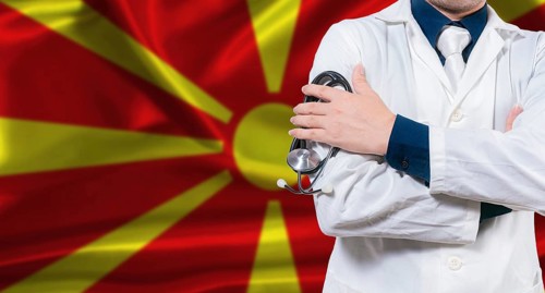Macedonian national health system, Medical professional holding sthetoscope isolated