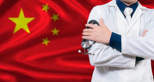 Chinese national health system, Medical professional holding sthetoscope isolated