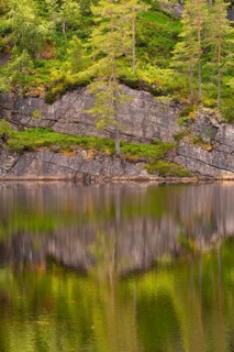 View of the reflection of nature in the water of Lake Kaldvatn, Kviteseid, Telemark, Norway