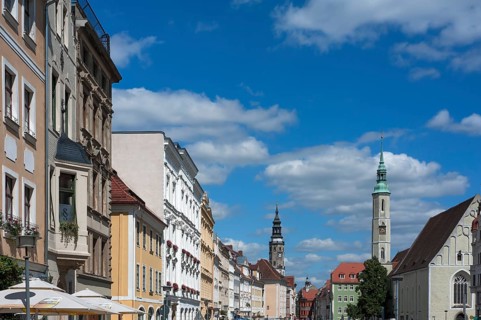 Houses with various architectural styles on Ohermarkt, the Old Town Hall Tower at the back left,